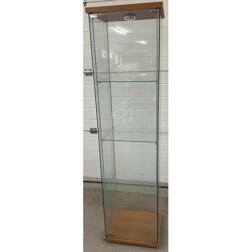 1314 - A modern square shaped glass cabinet with front opening full sized door and 3 interior glass shelves... 