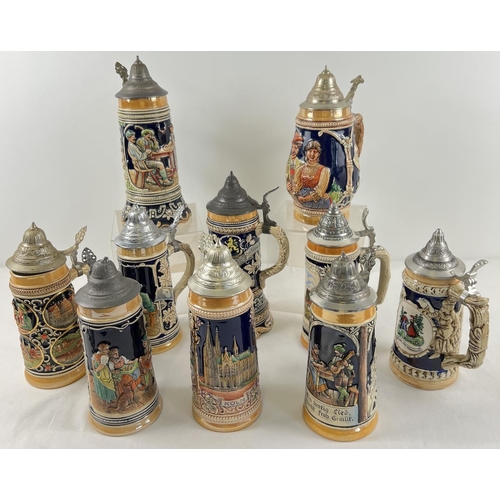 1182 - A collection of 10 assorted large vintage lidded ceramic steins, to include musical examples. In var... 