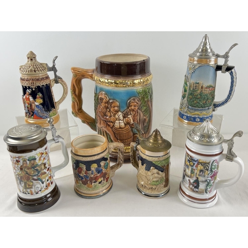 1183 - A very large ornamental ceramic stein together with 6 other smaller assorted steins. Largest approx.... 