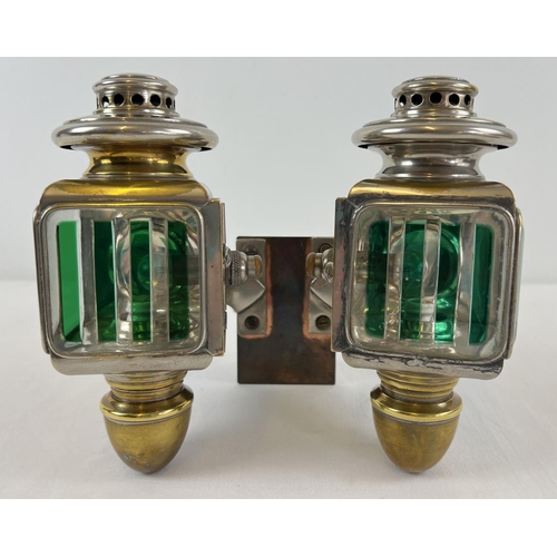 1213 - A pair of early 20th century French acetylene car lamps with green striped lenses. Mounted onto a co... 