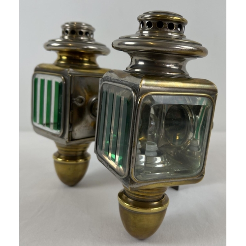 1213 - A pair of early 20th century French acetylene car lamps with green striped lenses. Mounted onto a co... 