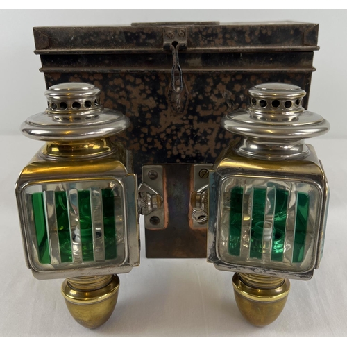 1213 - A pair of early 20th century French acetylene car lamps with green striped lenses. Mounted onto a co... 