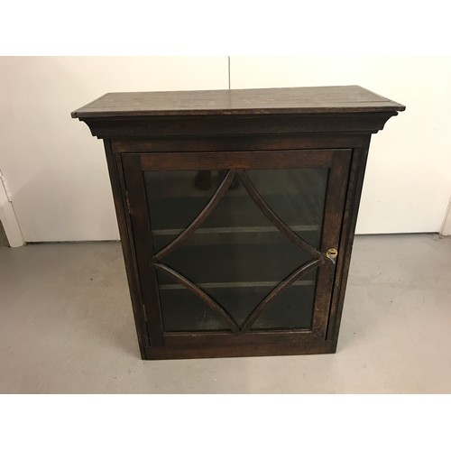 1317 - An antique dark oak, glass fronted wall cabinet with decorative carved panel sides. 2 adjustable int... 