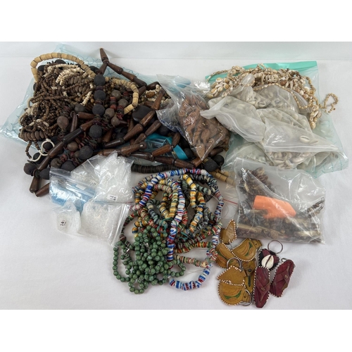 1095 - A large collection of assorted ethnic beaded jewellery and beads for jewellery making. To include wo... 