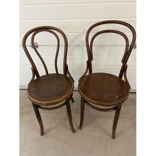 1285 - A pair of vintage European dark wood bentwood bistro chairs by Mundus and J&J Kohn. With embossed fo... 