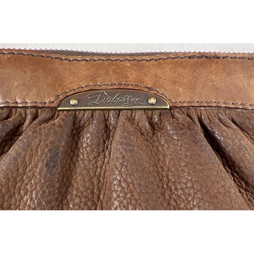 28 - A brown leather wristlet clutch purse by Dubarry, Ireland together with a large orange faux leather ... 