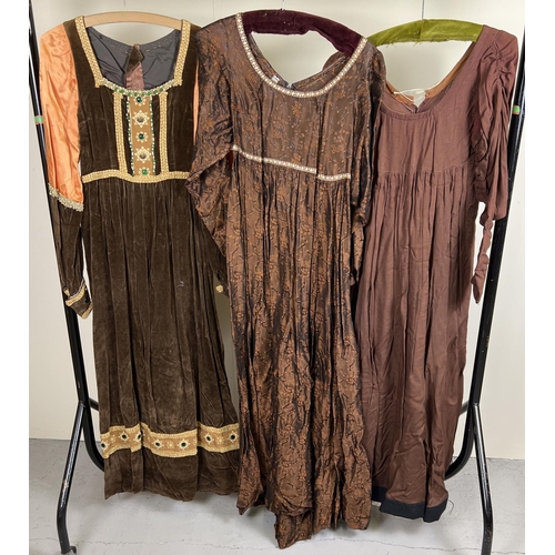 67 - 3 vintage theatre costume Georgian style long sleeved dresses. In brown tones.