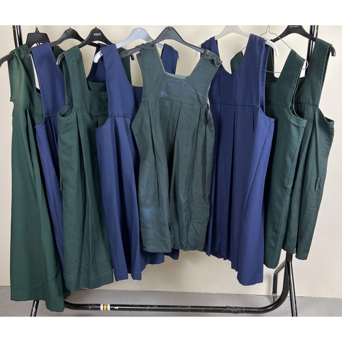 90 - 8 theatre costume adult sized blue and green school pinafore dresses.