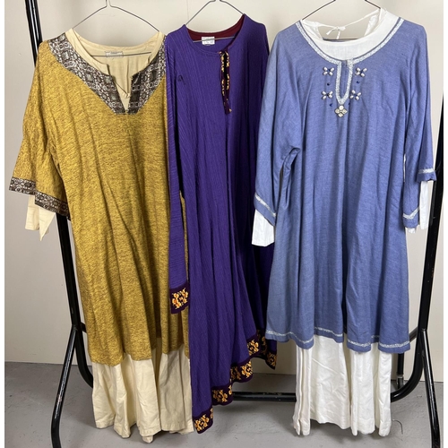 98 - 3 medieval style theatre costume long tunics to include one with beaded & metallic thread detail.