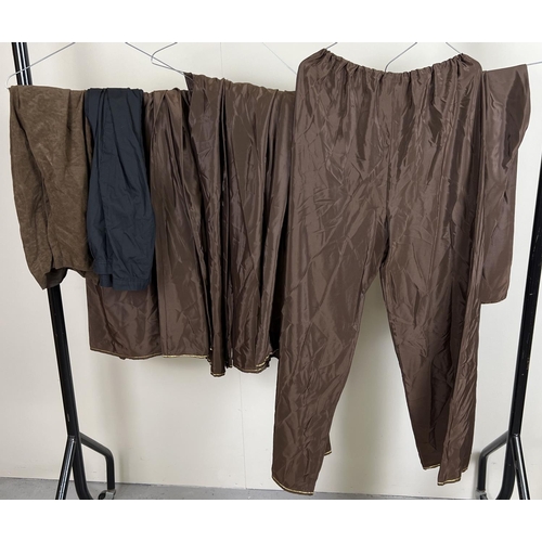 103 - 9 pairs of theatre costume trousers and pantaloons in brown and black.