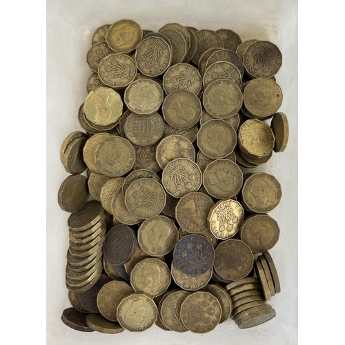 18 - A tub of vintage dodecagon shaped three pence coins. To include sovereign heads of George VI and Eli... 