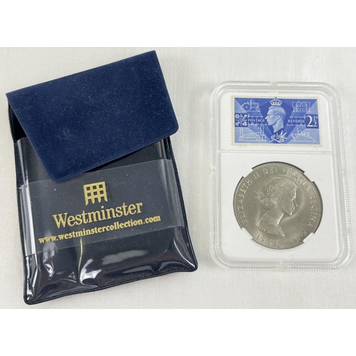 29 - A cased collectors 1965 Churchill crown coin with a 1946 George VI 2½D blue stamp.