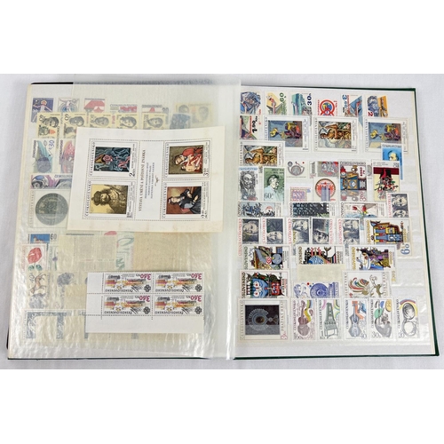 126 - A green vintage stamp album containing a collection of unused world stamps together with loose sheet... 