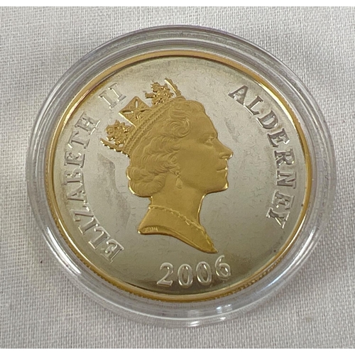 65 - A 2006 Alderney silver and gold plated proof five pound coin, in plastic capsule case.