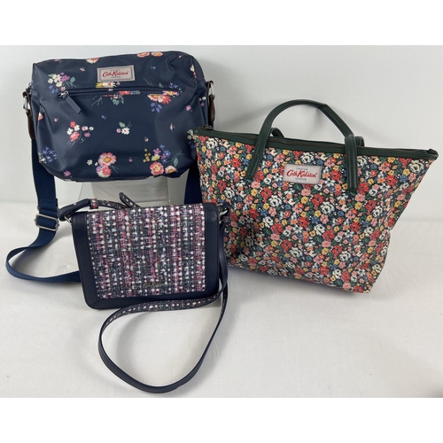 1324 - 3 designer handbags by Cath Kidston. A navy floral over the body bag with canvas strap, a floral des... 