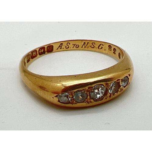 1003 - An Edwardian 18ct gold and diamond engagement ring. Band style set with 5 graduating size round cut ... 