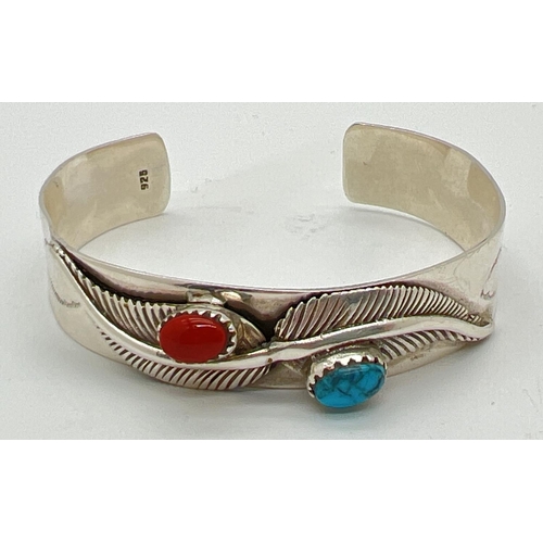 1009 - An Native American style cuff bangle with feather style decoration and natural stones. Inside marked... 