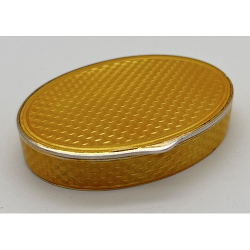 1128 - An early 20th century Marius Hammer Norwegian silver, Asprey oval shaped snuff box with yellow guill... 