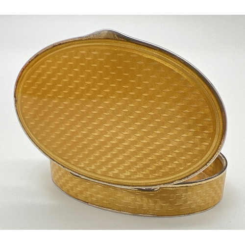 1128 - An early 20th century Marius Hammer Norwegian silver, Asprey oval shaped snuff box with yellow guill... 