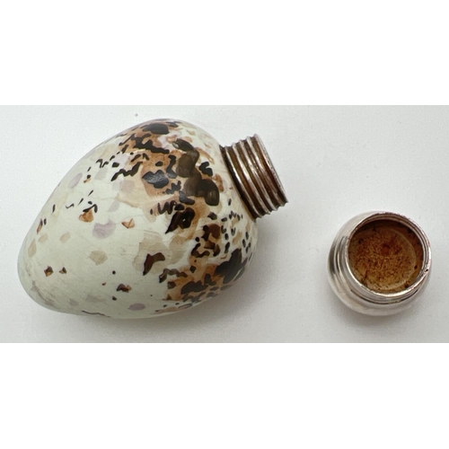 1131 - A Victorian novelty scent bottle modelled as a bird egg, with hallmarked silver lid. Porcelain pale ... 