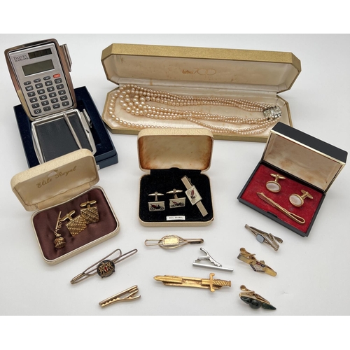 1025 - A collection of boxed and unboxed vintage costume jewellery, tie pins & cuff links. Together with a ... 