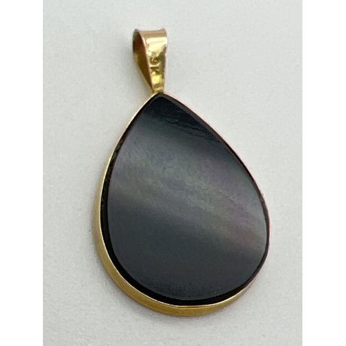 1038 - A 9ct gold and black onyx teardrop shaped pendant with anchor detail made with slices of opal. Gold ... 