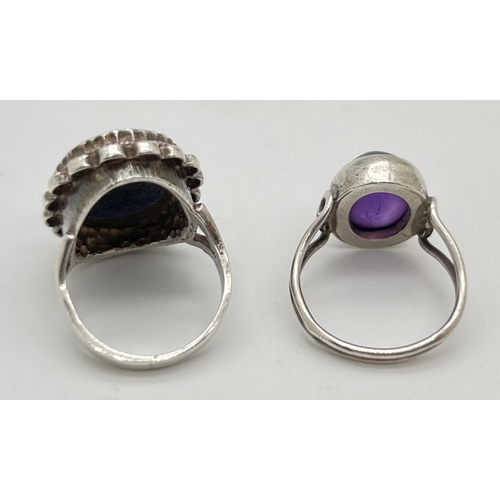 1046 - 2 modern design silver stone set dress rings. One set with an oval cabochon of lapis lazuli and the ... 