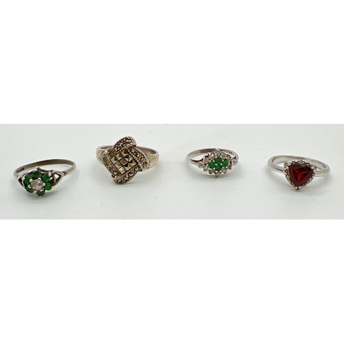 1064 - 4 stone set silver dress rings. A modern square design ring set with marcasite stones, a vintage flo... 