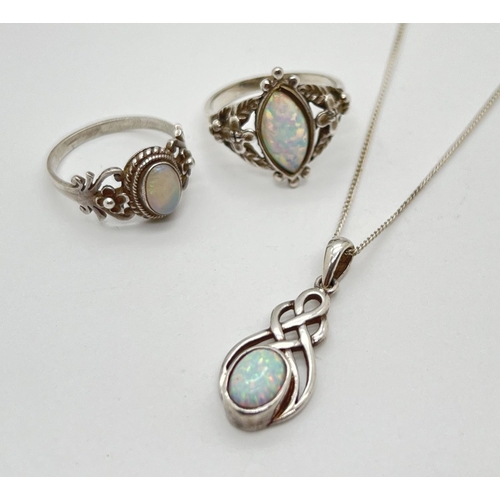 1068 - 3 pieces of opal set silver and white metal jewellery. 2 decorative dress rings and a Celtic style p... 