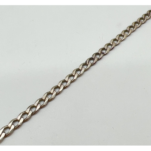 1078 - A vintage silver 9 inch curb chain bracelet with lobster clasp. Marked 925 with scales mark to fixin... 