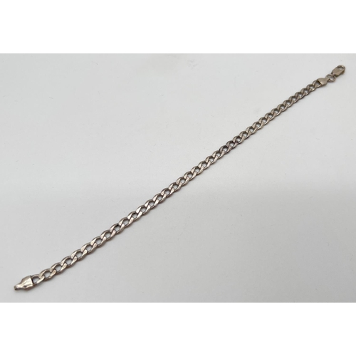 1078 - A vintage silver 9 inch curb chain bracelet with lobster clasp. Marked 925 with scales mark to fixin... 