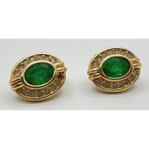 1085 - A pair of vintage gold tone Christian Dior clip on earrings set with central green stones surrounded... 