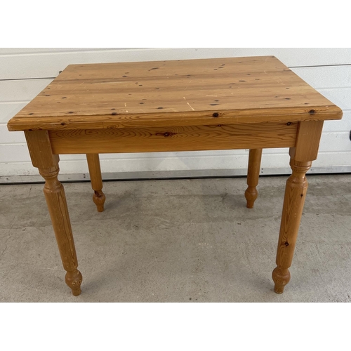 1352 - A small sized pine kitchen table with turned legs. Approx. 75 x 92 x 68cm.