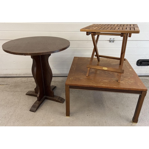 1355 - 3 vintage wooden tables. A small circular occasional table with pedestal base, a small slatted top f... 