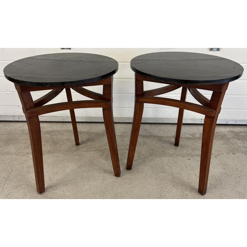 1357 - 2 vintage tripod legged occasional/pub tables with black high polish circular wooden tops. Shaped su... 