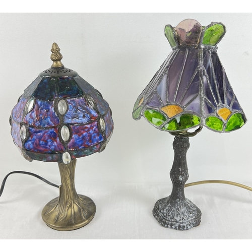 1341 - 2 metal based Tiffany style table lamps with coloured glass leaded shades. A lamp with hexagonal sha... 