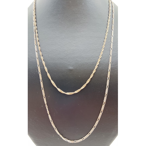 87 - 2 silver chain necklaces both with lobster style clasps. A 24 inch Figaro chain (5.8g) together with... 