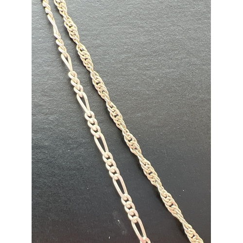 87 - 2 silver chain necklaces both with lobster style clasps. A 24 inch Figaro chain (5.8g) together with... 