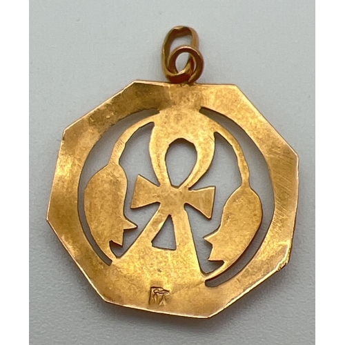 20 - An octagonal 22ct gold Ankh, symbol of life & floral design pendant, on hanging bale. Egyptian gold ... 