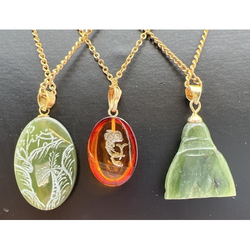 32 - 3 semi-precious stone costume jewellery pendant necklaces. An oval green jade pendant with carved or... 