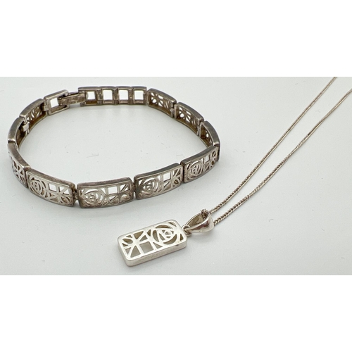 35 - A silver Rennie Mackintosh style pierced work 10 panel bracelet together with a matching pendant on ... 