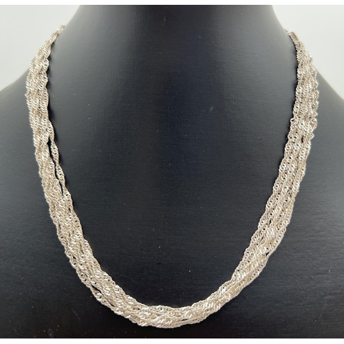 93 - A silver multi strand rope chain necklace with lobster claw clasp. Approx. 18