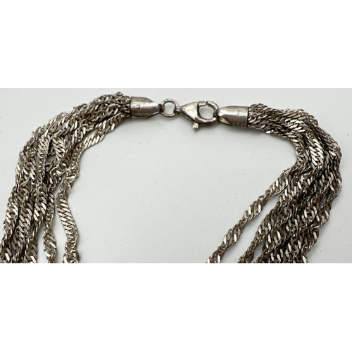 93 - A silver multi strand rope chain necklace with lobster claw clasp. Approx. 18