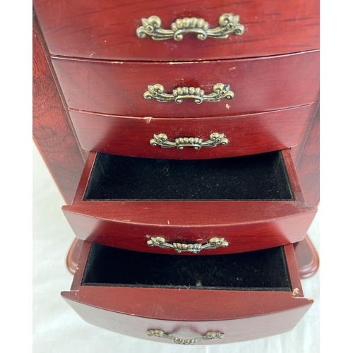 44 - A vintage wooden chest style jewellery box. 6 front opening drawers with small square compartments t... 