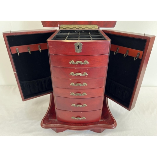 44 - A vintage wooden chest style jewellery box. 6 front opening drawers with small square compartments t... 