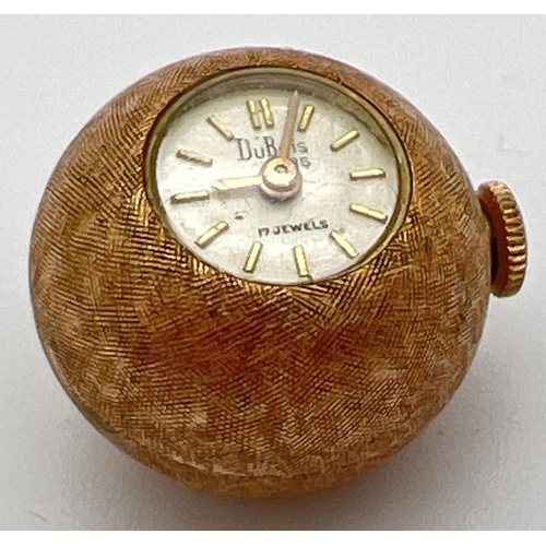 45 - A small vintage ball watch by Dubois 1785. With engine turned decoration to case, tests as 14ct gold... 