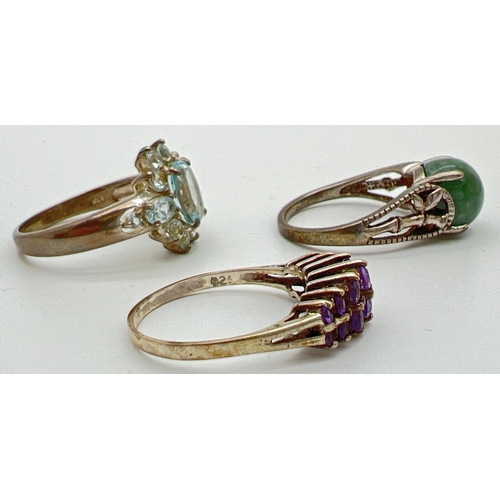 46 - 3 silver stone set dress/cocktail rings. A cathedral style ring set with 12 round cat graduating siz... 