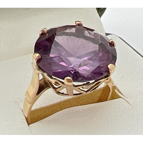 2 - An 18k Egyptian gold dress ring set with a large round cut purple amethyst. Pierced heart detail to ... 