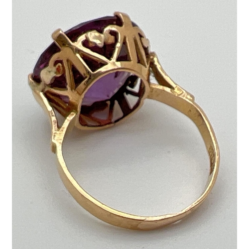 2 - An 18k Egyptian gold dress ring set with a large round cut purple amethyst. Pierced heart detail to ... 