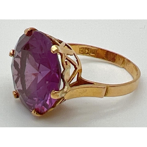 2 - An 18k Egyptian gold dress ring set with a large round cut purple amethyst. Pierced heart detail to ... 